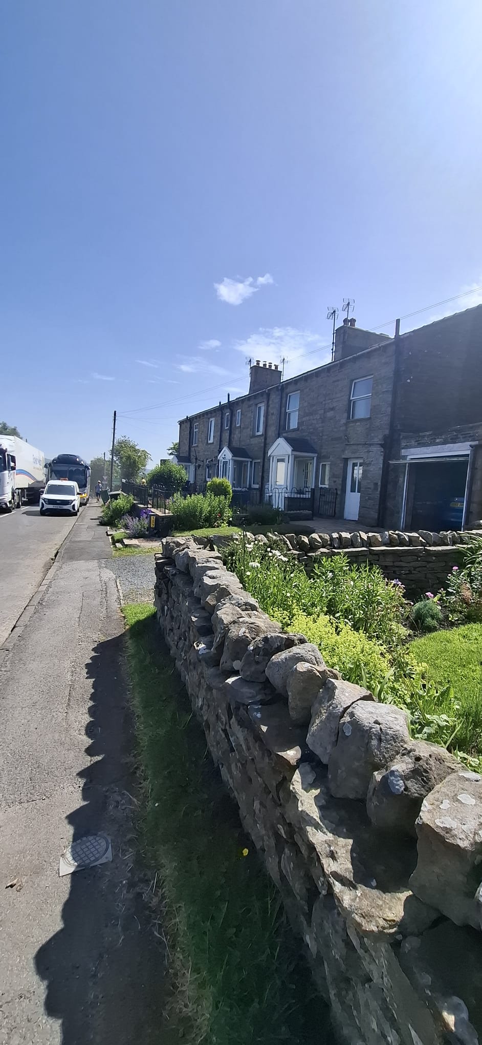 Lancaster Cottage exterior with stone wall